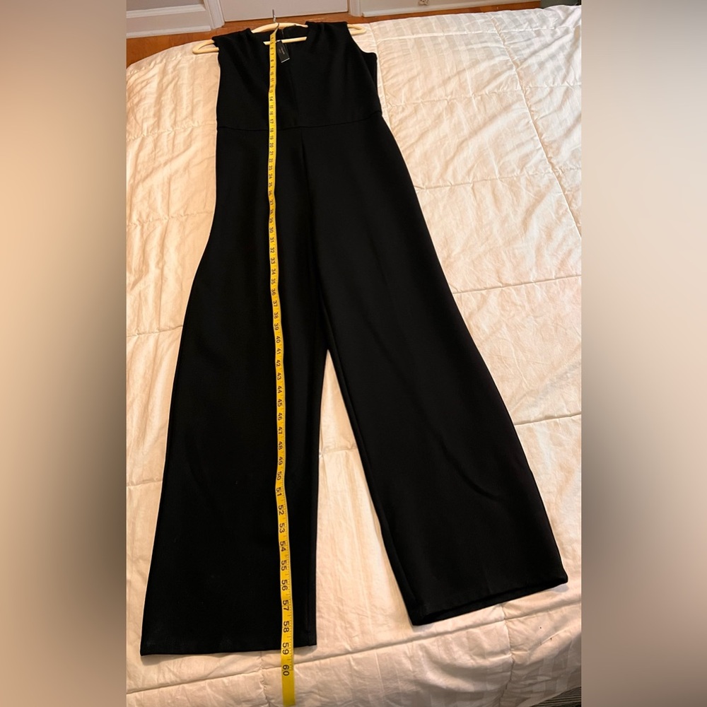 Beautiful jumpsuit by Tahari V-neck black jumpsuit.  Size 8 NWT